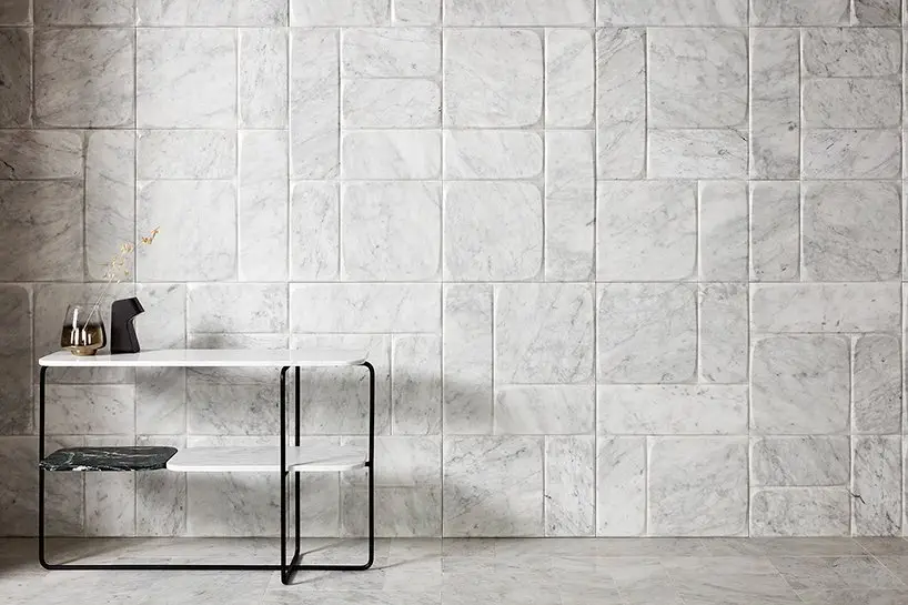 wall&floors- ‘punto’ wall covering with inlays in brass by andrea maffei architects